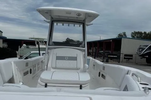Slide: The Image of 2024 Sea Fox 268 Commander boat interior with white seating and T-top. - 14