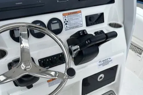Slide: The Image of 2024 Sea Fox 268 Commander boat helm with steering wheel and controls. - 8