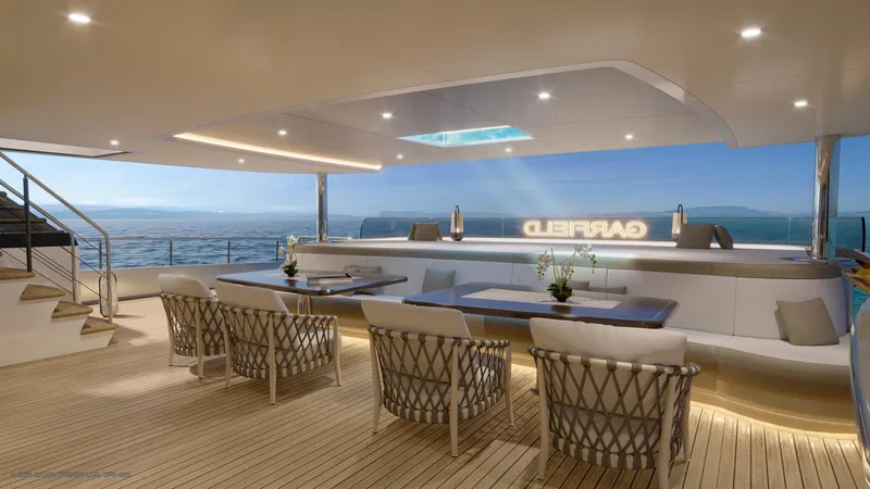 Slide: The Image of Luxurious yacht deck of Dynamic Project Garfield 2024, featuring elegant seating and ocean views. - 14