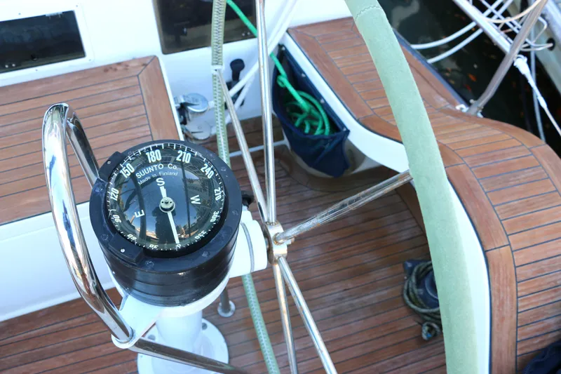 Slide: The Image of Compass and steering wheel on a 1985 Baltic 35 sailboat. - 13