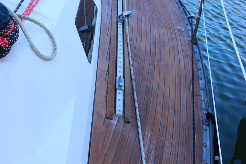 Slide: The Image of Deck of a 1985 Baltic 35 sailboat with wooden finish and rigging. - 19