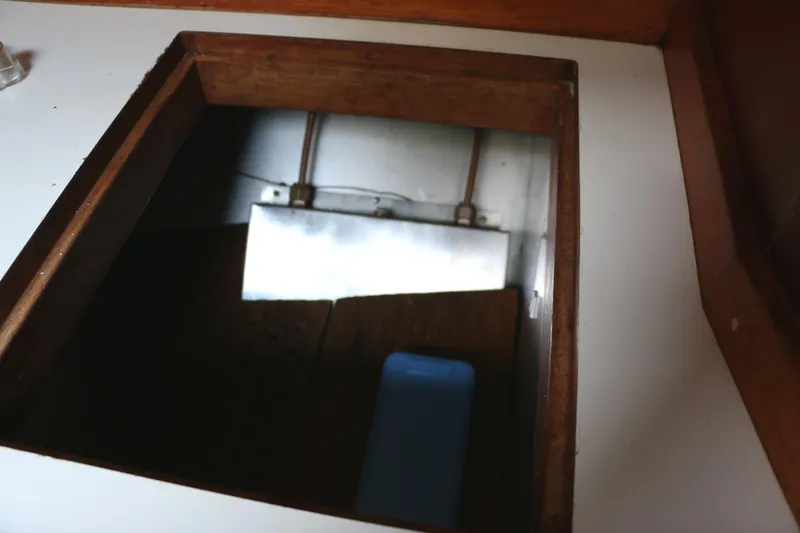 Slide: The Image of Open storage compartment in 1985 Baltic 35 sailboat galley. - 39