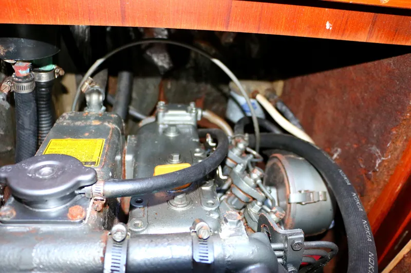 Slide: The Image of 1985 Baltic 35 engine compartment with visible components and wiring. - 44