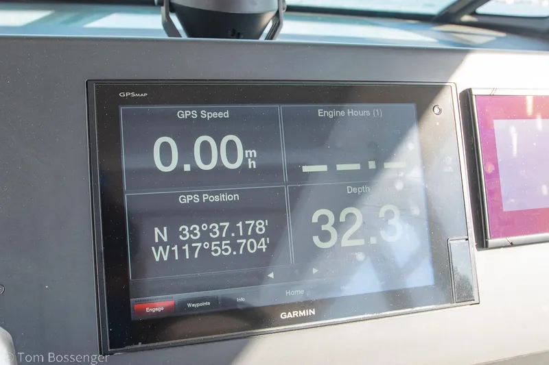 Slide: The Image of Garmin GPS display on 2018 Axopar 37 Sun-Top showing speed, position, and depth. - 13