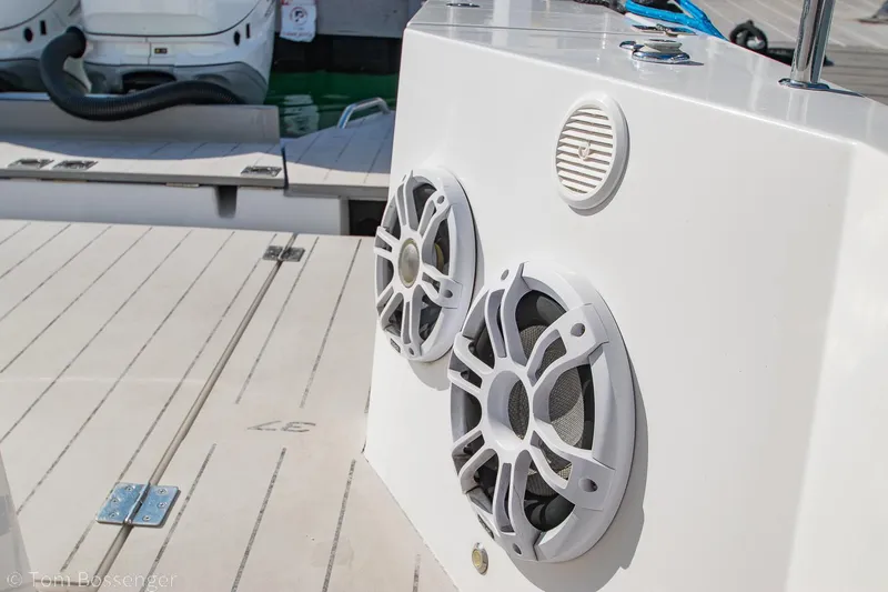 Slide: The Image of 2018 Axopar 37 Sun-Top boat speakers on deck, showcasing modern marine audio system. - 27