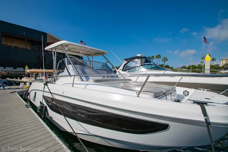 Slide: The Image of 2022 Beneteau Flyer 9 docked at marina under clear blue sky. - 1