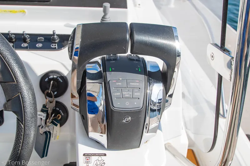 Slide: The Image of Throttle controls on a 2022 Beneteau Flyer 9 boat dashboard. - 14