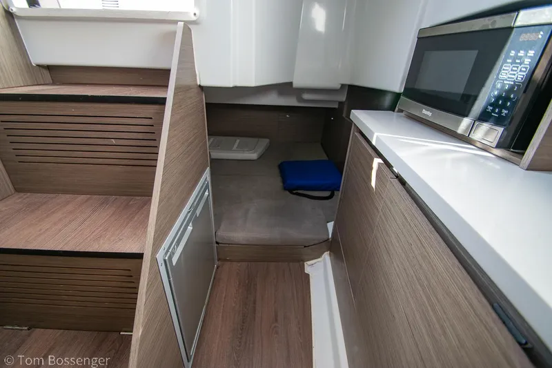 Slide: The Image of Interior cabin of 2022 Beneteau Flyer 9 with wood finish and modern amenities. - 20