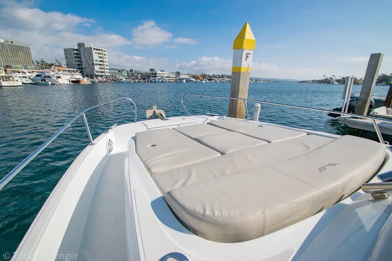 Slide: The Image of 2022 Beneteau Flyer 9 boat with sunbathing deck, docked in a marina. - 23