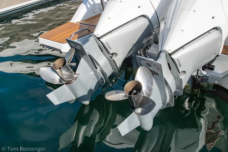 Slide: The Image of Twin outboard motors on a 2022 Beneteau Flyer 9, reflecting in water. - 30