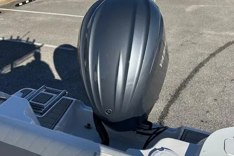 Slide: The Image of 2024 Sea Fox 228 Commander boat with outboard motor in parking lot. - 14