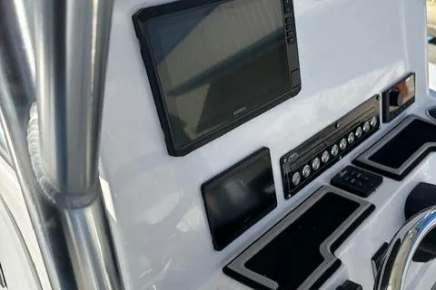 Slide: The Image of 2024 Sea Fox 228 Commander dashboard with electronic displays and controls. - 15