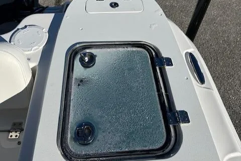 Slide: The Image of 2024 Sea Fox 228 Commander boat deck with storage compartment. - 17