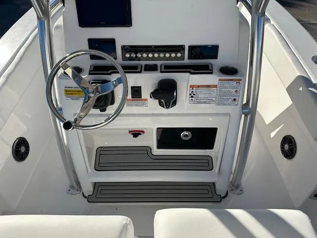 Slide: The Image of 2024 Sea Fox 228 Commander boat console with steering wheel and control panel. - 5