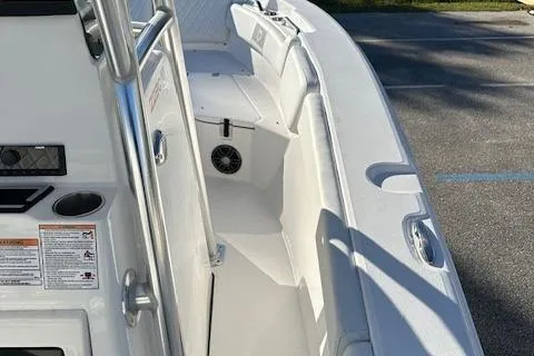 Slide: The Image of 2024 Sea Fox 228 Commander boat interior, featuring seating and storage compartments. - 9