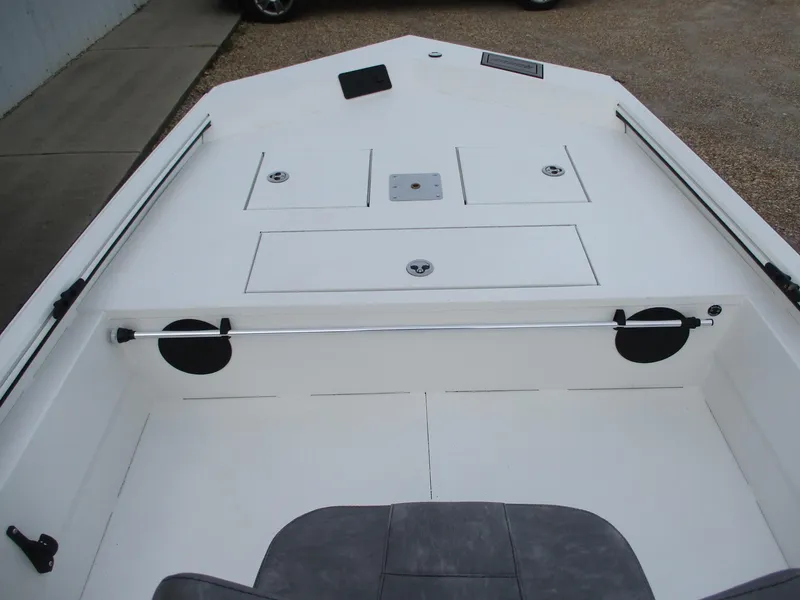 Slide: The Image of 2024 Avid 18 Rogue CC boat interior with storage compartments and seating. - 10