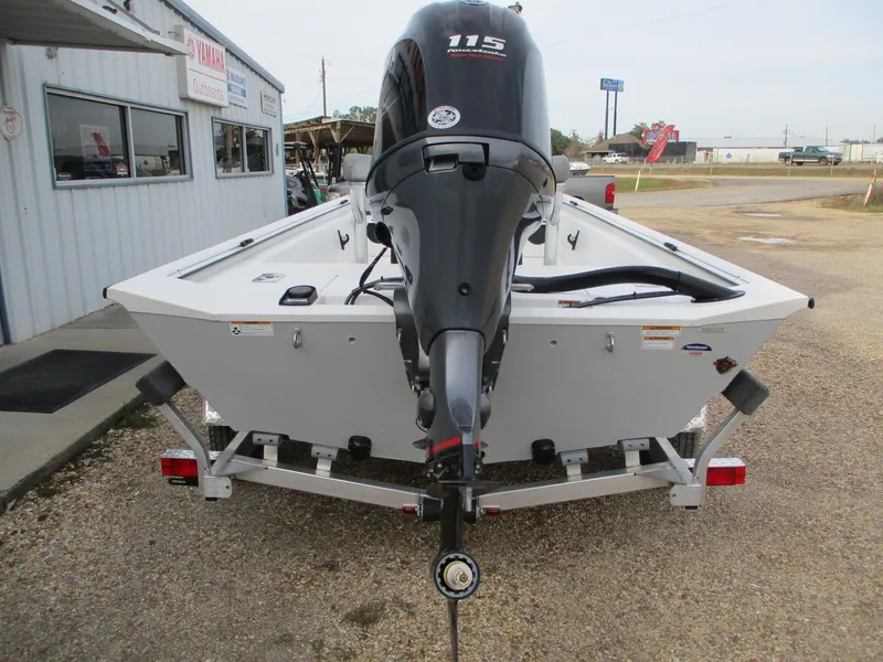 Slide: The Image of 2024 Avid 18 Rogue CC boat with 115 HP outboard motor on trailer. - 4