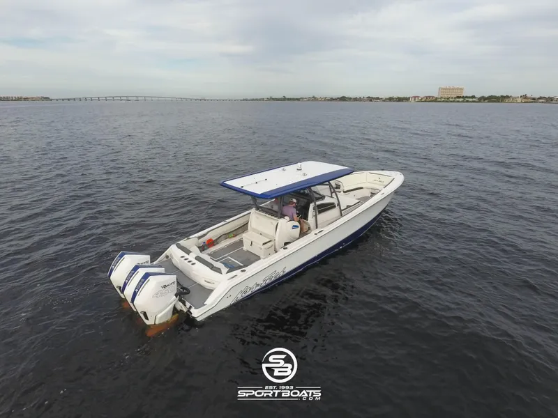 Slide: The Image of 2021 Nor-Tech 390 Sport boat on open water. - 10
