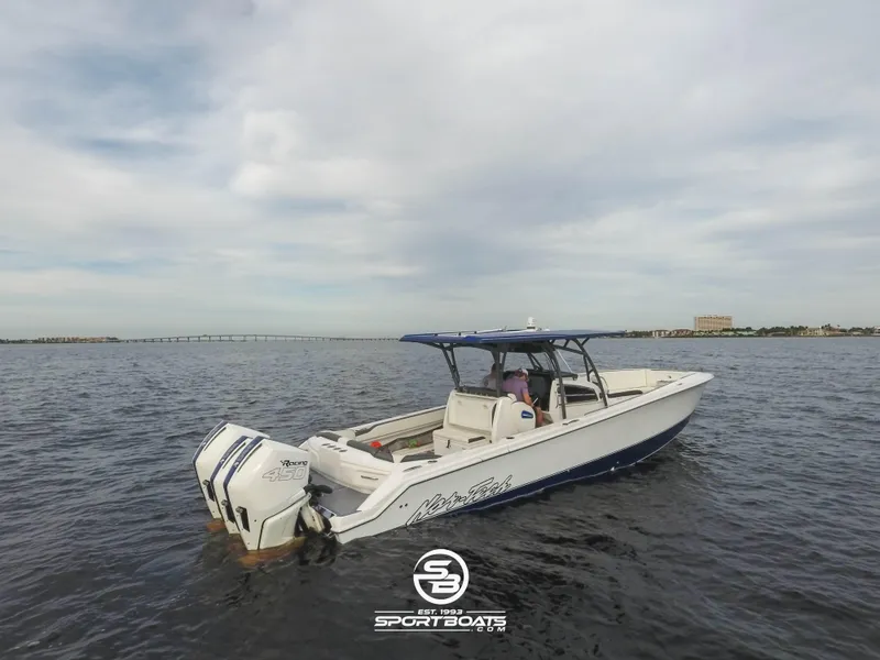 Slide: The Image of 2021 Nor-Tech 390 Sport boat on open water. - 11