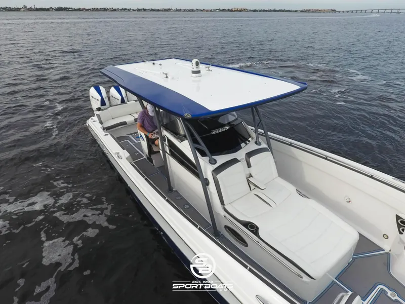 Slide: The Image of 2021 Nor-Tech 390 Sport boat on open water, aerial view. - 15