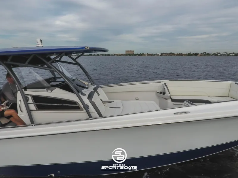 Slide: The Image of 2021 Nor-Tech 390 Sport boat cruising on open water. - 21