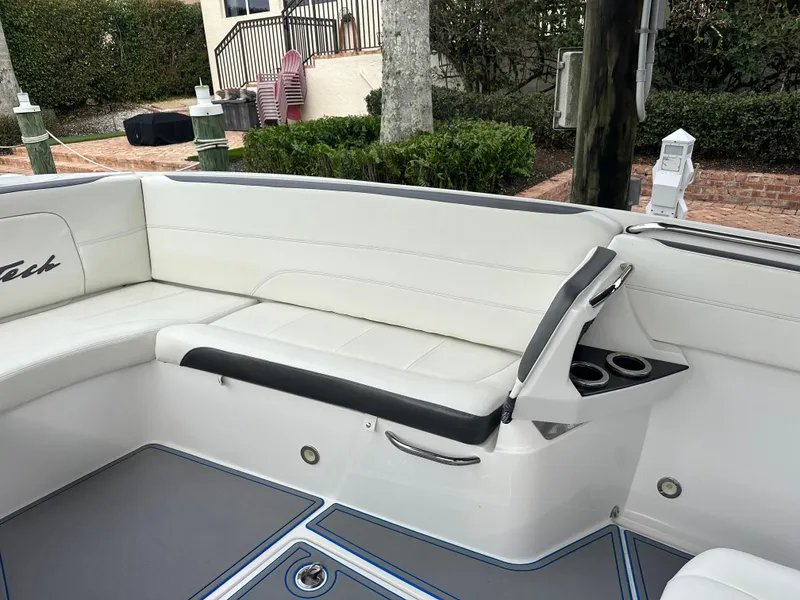 Slide: The Image of Luxury seating on a 2021 Nor-Tech 390 Sport boat with white upholstery. - 33