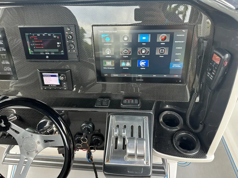 Slide: The Image of 2021 Nor-Tech 390 Sport dashboard with advanced navigation and control systems. - 46