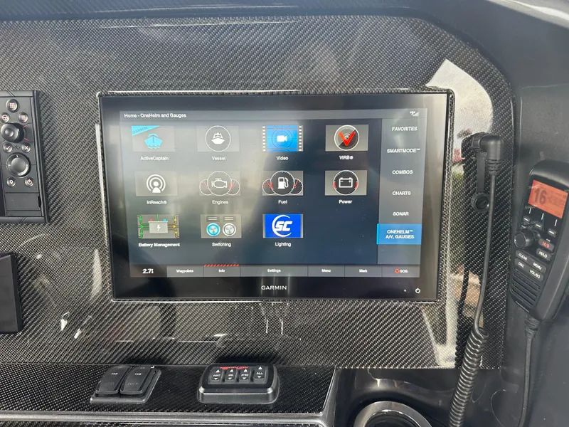 Slide: The Image of 2021 Nor-Tech 390 Sport dashboard with Garmin touchscreen and control panel. - 47