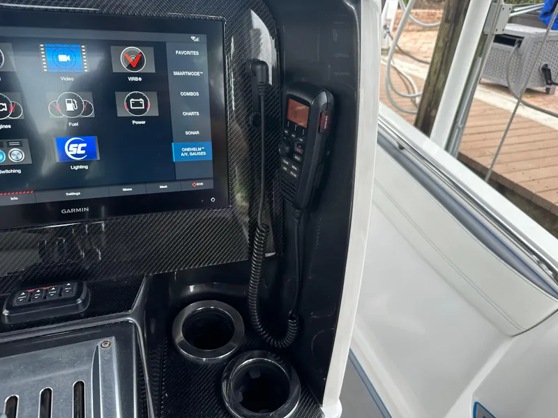 Slide: The Image of Nor-Tech 390 Sport 2021 dashboard with Garmin display and communication device. - 48