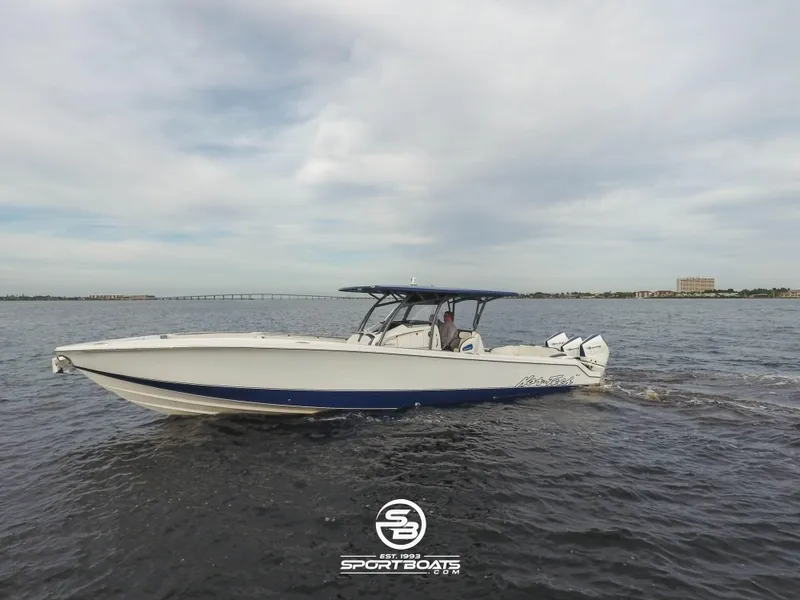 Slide: The Image of 2021 Nor-Tech 390 Sport boat cruising on open water. - 6