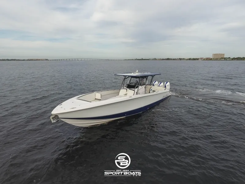 Slide: The Image of 2021 Nor-Tech 390 Sport boat cruising on open water. - 8