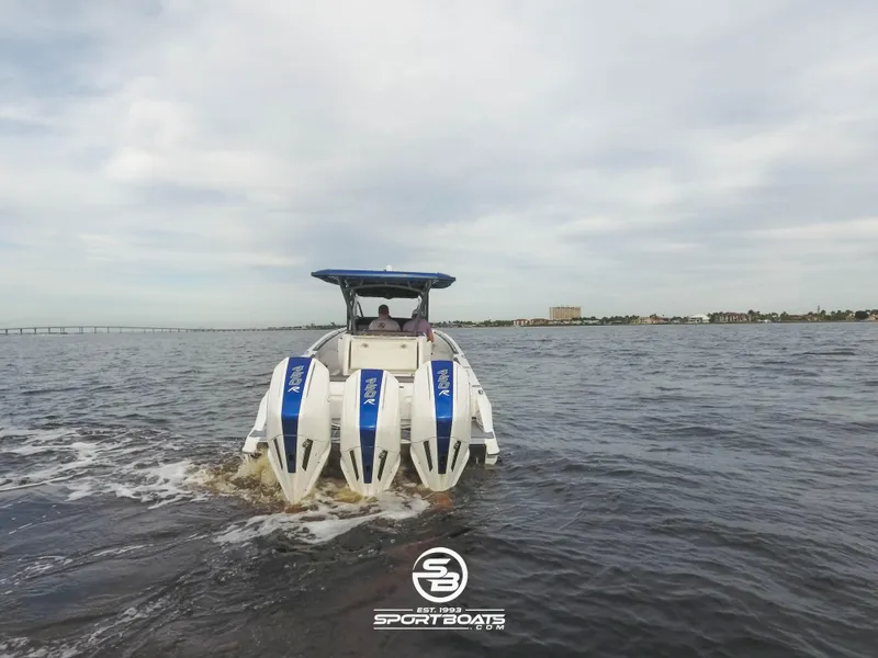 Slide: The Image of 2021 Nor-Tech 390 Sport boat cruising on open water. - 14