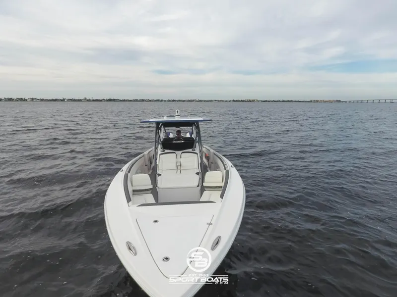 Slide: The Image of 2021 Nor-Tech 390 Sport boat on open water. - 24