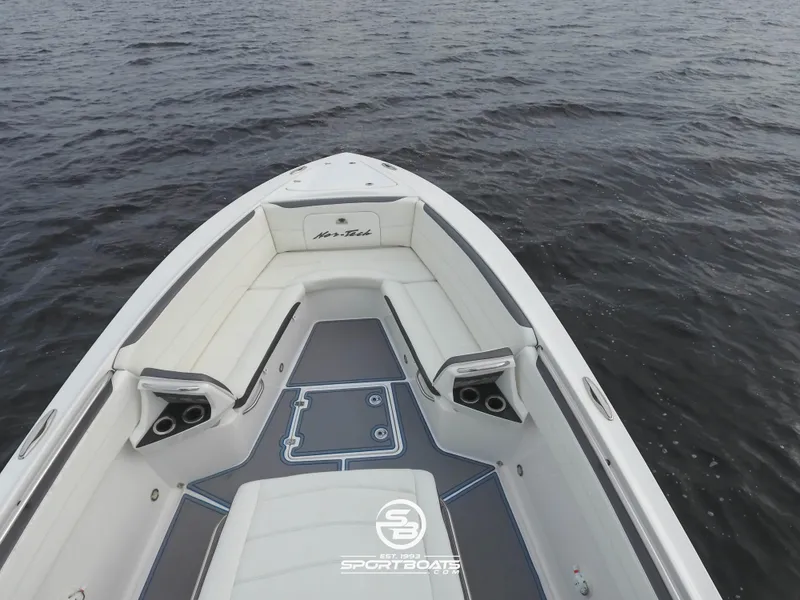 Slide: The Image of 2021 Nor-Tech 390 Sport boat bow seating area on the water. - 26