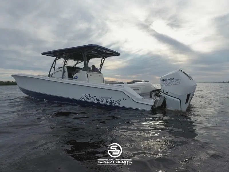 Slide: The Image of 2021 Nor-Tech 390 Sport boat on water at sunset. - 29