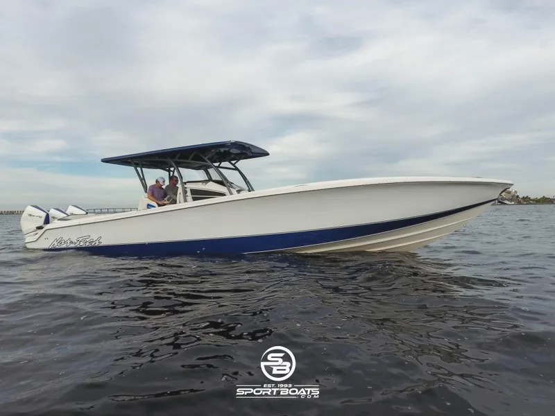 Slide: The Image of 2021 Nor-Tech 390 Sport boat on water with blue accents. - 3
