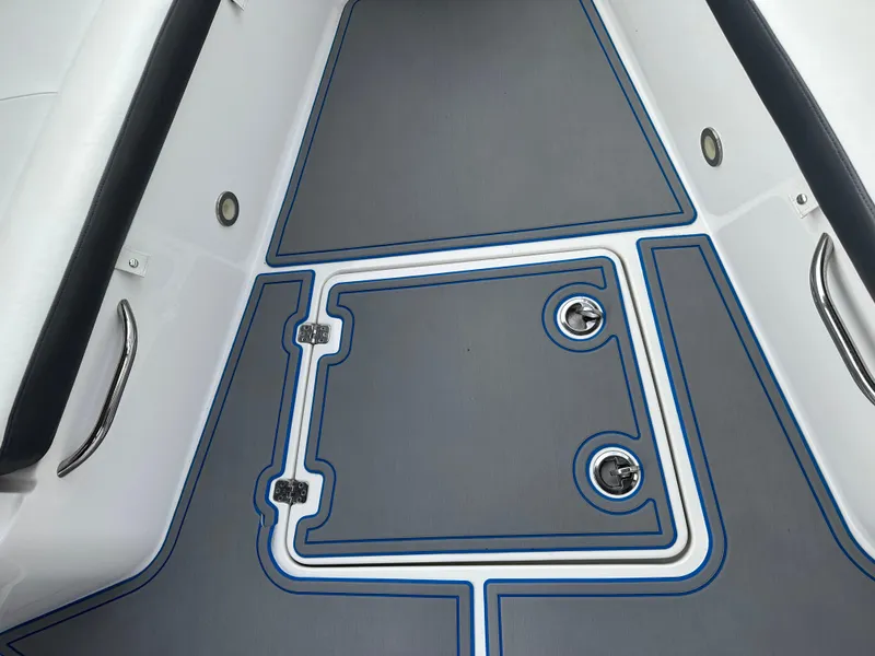 Slide: The Image of 2021 Nor-Tech 390 Sport boat deck with gray and blue non-slip flooring. - 36