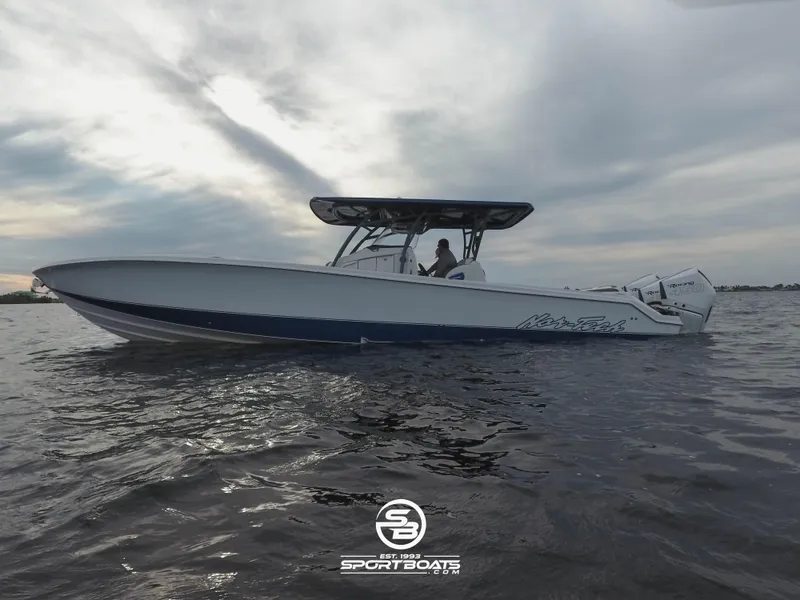 Slide: The Image of 2021 Nor-Tech 390 Sport boat on water at sunset. - 4