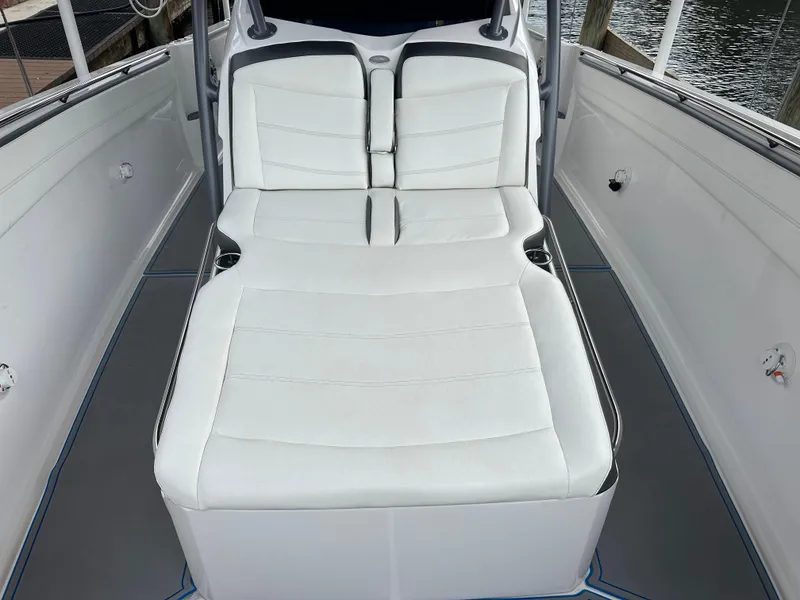 Slide: The Image of 2021 Nor-Tech 390 Sport boat with white cushioned seating. - 41