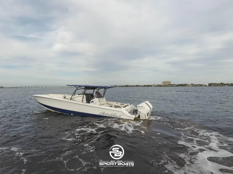 Slide: The Image of 2021 Nor-Tech 390 Sport boat cruising on open water. - 5