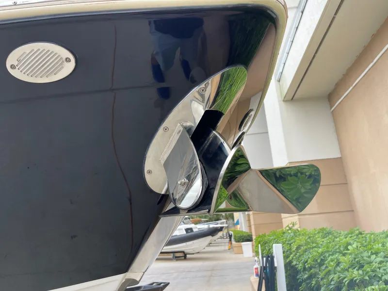 Slide: The Image of Close-up of 2015 Cruisers Sport Series 328 boat propeller and stern. - 15