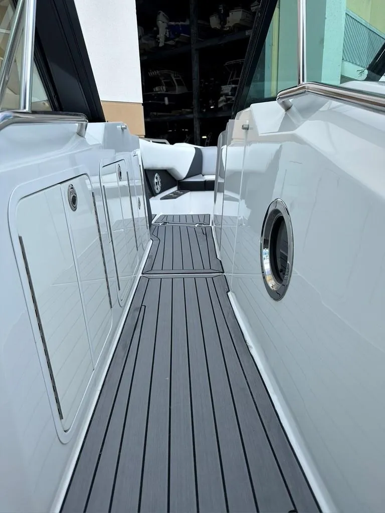 Slide: The Image of 2015 Cruisers Sport Series 328 boat deck with sleek design and modern features. - 7