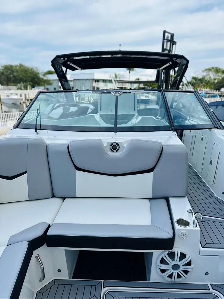 Slide: The Image of 2015 Cruisers Sport Series 328 boat with sleek seating and modern design. - 8