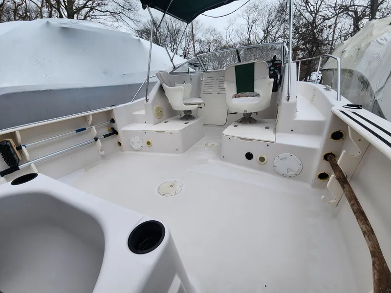 Slide: The Image of 1997 Pro-Line 201 Walkaround boat interior with seating and steering console. - 11