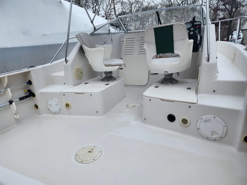 Slide: The Image of 1997 Pro-Line 201 Walkaround boat interior with swivel seats and clean deck. - 12