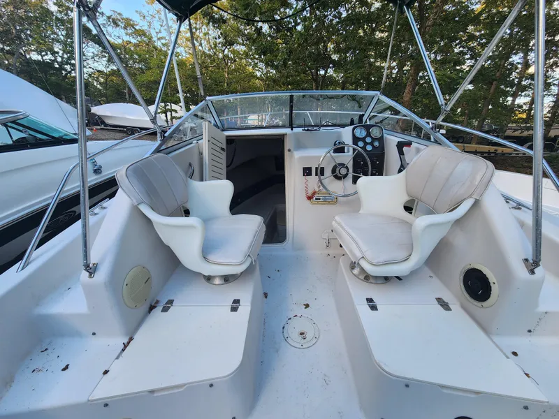 Slide: The Image of 1997 Pro-Line 201 Walkaround boat interior with dual seats and steering console. - 5