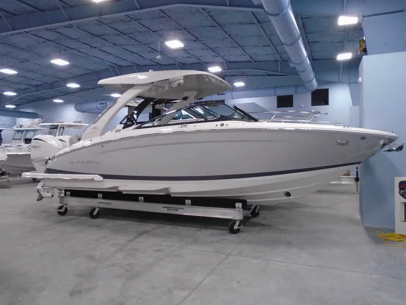 The Image of 2024 Regal LX9 boat displayed indoors, showcasing sleek design and modern features. - 0