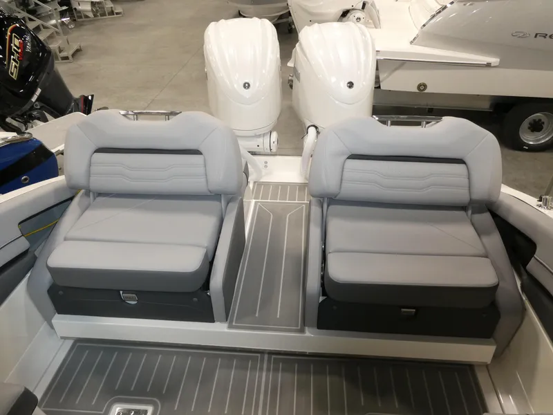 Slide: The Image of 2024 Regal LX9 boat with dual seating and twin outboard engines. - 11