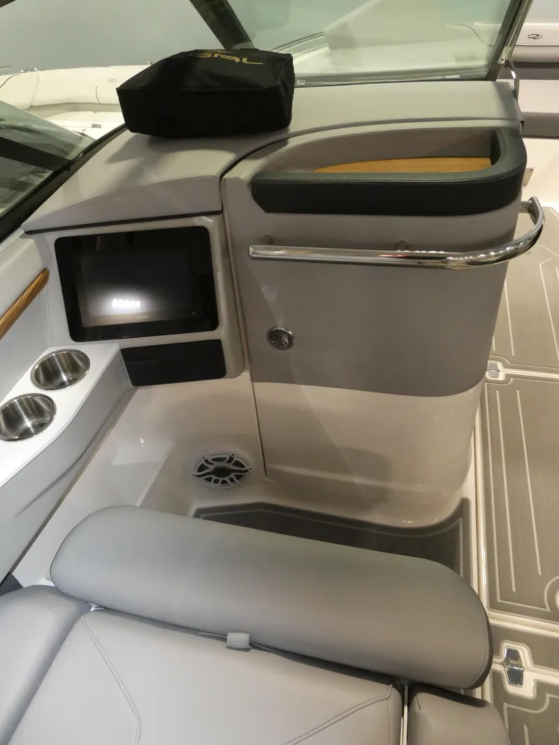 Slide: The Image of 2024 Regal LX9 boat interior with modern dashboard and seating. - 16