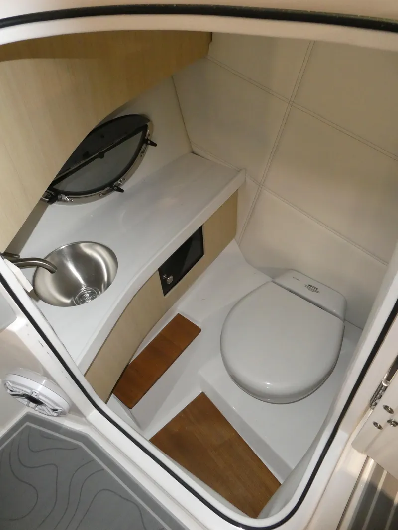 Slide: The Image of Modern bathroom in 2024 Regal LX9 boat with sink and toilet. - 18